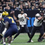Purdue quarterback Aidan O'Connell throws during the first half of the Big Ten championship NCAA college football game against Michigan, Saturday, Dec. 3, 2022, in Indianapolis. (AP Photo/AJ Mast)