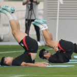 
              South Korea's Son Heung-min, right, warms up during a training session at Al Egla Training Site 5 in Doha, Qatar, Wednesday, Nov. 30, 2022. South Korea will play its third match in Group H in the World Cup against Portugal on Dec. 2. (AP Photo/Lee Jin-man)
            