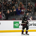 Arizona Coyotes fans cheer on right wing Clayton Keller after his empty-net goal against the Colorado Avalanche during the third period of an NHL hockey game in Tempe, Ariz., Tuesday, Dec. 27, 2022. The Coyotes won 6-3. (AP Photo/Ross D. Franklin)