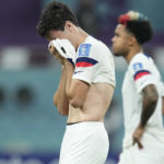 
              Gio Reyna of the United States, center, is dejected after the World Cup round of 16 soccer match between the Netherlands and the United States, at the Khalifa International Stadium in Doha, Qatar, Saturday, Dec. 3, 2022. Netherlands won 3-1. (AP Photo/Ebrahim Noroozi)
            