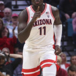 Arizona center Oumar Ballo (11) reacts after scoring against Indiana during the first half of an NCAA college basketball game Saturday, Dec. 10, 2022, in Las Vegas. (AP Photo/Chase Stevens)