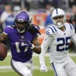 Minnesota Vikings wide receiver K.J. Osborn (17) runs from Indianapolis Colts safety Rodney Thomas II (25) after catching a pass during the second half of an NFL football game, Saturday, Dec. 17, 2022, in Minneapolis. (AP Photo/Andy Clayton-King)