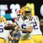 LSU quarterback Jayden Daniels (5) throws a pass in the first half of the Southeastern Conference Championship football game against Georgia Saturday, Dec. 3, 2022 in Atlanta. (AP Photo/John Bazemore)