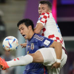 
              Japan's Wataru Endo, left, fights for the ball with Croatia's Ante Budimir during the World Cup round of 16 soccer match between Japan and Croatia at the Al Janoub Stadium in Al Wakrah, Qatar, Monday, Dec. 5, 2022. (AP Photo/Alessandra Tarantino)
            