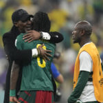
              Cameroon's head coach Rigobert Song, left, and Cameroon's Andre-Frank Zambo Anguissa celebrate at the end of the World Cup group G soccer match between Cameroon and Brazil, at the Lusail Stadium in Lusail, Qatar, Friday, Dec. 2, 2022. (AP Photo/Natacha Pisarenko)
            