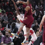 
              Cleveland Cavaliers forward Isaac Okoro, right, blocks a shot by Chicago Bulls forward Javonte Green during the first half of an NBA basketball game in Chicago, Saturday, Dec. 31, 2022. (AP Photo/Nam Y. Huh)
            