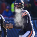 
              Chicago Bears quarterback Justin Fields (1) drop back to throw against the Buffalo Bills in the first half of an NFL football game in Chicago, Saturday, Dec. 24, 2022. (AP Photo/Nam Y. Huh)
            