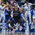 
              Kentucky's Dre'una Edwards (44) celebrates after making the winning shot to beat South Carolina in the NCAA women's college basketball Southeastern Conference tournament championship game Sunday, March 6, 2022, in Nashville, Tenn. Kentucky won 64-62. (AP Photo/Mark Humphrey)
            