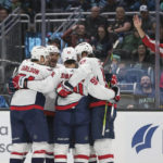 
              Washington Capitals players, from left to right, John Carlson, Alex Ovechkin, Marcus Johansson and Dylan Strome celebrate after Conor Sheary's goal during the first period of an NHL hockey game against the Seattle Kraken, Thursday, Dec. 1, 2022, in Seattle. (AP Photo/Jason Redmond)
            