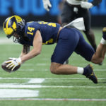 Michigan wide receiver Roman Wilson attempts to catch a pass during the first half of the Big Ten championship NCAA college football game against Purdue, Saturday, Dec. 3, 2022, in Indianapolis. (AP Photo/AJ Mast)
