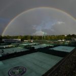 A rainbow arches in the sky as seen from the courts on day four of the Wimbledon tennis championships in London, Thursday, June 30, 2022. (AP Photo/Alastair Grant)