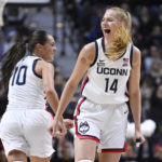 
              Connecticut's Nika Muhl (10) celebrates with Connecticut's Dorka Juhasz (14) after Juhasz hit a 3-point basket during the first half of an NCAA college basketball game against Florida State, Sunday, Dec. 18, 2022, in Uncasville, Conn. (AP Photo/Jessica Hill)
            