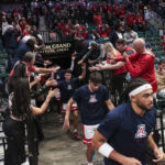 Arizona players enter the court before playing Indiana in an NCAA college basketball game Saturday, Dec. 10, 2022, in Las Vegas. (AP Photo/Chase Stevens)