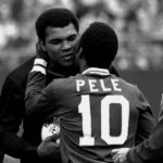 
              FILE - Soccer player Pele embraces boxer Muhammad Ali during a ceremony honoring the Brazilian soccer star of the New York Cosmos at Giants Stadium, East Rutherford, N.J., Oct. 1, 1977. Pelé, the Brazilian king of soccer who won a record three World Cups and became one of the most commanding sports figures of the last century, died in Sao Paulo on Thursday, Dec. 29, 2022. He was 82.  (AP Photo/Richard Drew, File)
            
