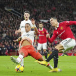 
              FILE -  Manchester United's Cristiano Ronaldo, right, attempts a shot at goal in front of West Ham's Thilo Kehrer during the English Premier League soccer match between Manchester United and West Ham United at Old Trafford stadium in Manchester, England, Sunday, Oct. 30, 2022.  Saudi Arabian soccer club Al Nassr on Friday, Dec. 30, 2022, announced the signing of Ronaldo, ending speculation about the five-time Ballon d'Or winner's future.  (AP Photo/Jon Super, FIle(
            