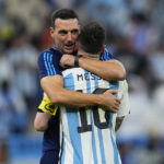 
              Argentina's head coach Lionel Scaloni embraces Argentina's Lionel Messi at the end of the World Cup quarterfinal soccer match between the Netherlands and Argentina, at the Lusail Stadium in Lusail, Qatar, Saturday, Dec. 10, 2022. (AP Photo/Natacha Pisarenko)
            