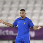 France's Kylian Mbappe gestures during a training session in Doha, Qatar, Tuesday, Dec. 13, 2022 on the eve of their World Cup semifinal soccer match against Morocco. (AP Photo/Christophe Ena)