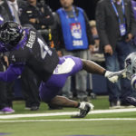 TCU wide receiver Taye Barber (4) dives into the end zone for a touchdown in front of Kansas State cornerback Julius Brents (23) in the first half of the Big 12 Conference championship NCAA college football game, Saturday, Dec. 3, 2022, in Arlington, Texas. (AP Photo/Mat Otero)