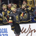 Vegas Golden Knights left wing William Carrier (28) is congratulated for his goal against the Arizona Coyotes during the third period of an NHL hockey game Wednesday, Dec. 21, 2022, in Las Vegas. (AP Photo/Chase Stevens)