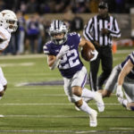
              FILE - Kansas State running back Deuce Vaughn (22) carries the ball against Texas during the second half of an NCAA college football game Saturday, Nov. 5, 2022, in Manhattan, Kan. Vaughn was selected to The Associated Press All-America team released Monday, Dec. 12, 2022. (AP Photo/Reed Hoffmann, File)
            
