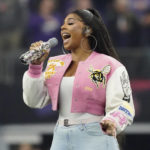 Ashanti sings the national anthem before the Big 12 Conference championship NCAA college football game between Kansas State and TCU, Saturday, Dec. 3, 2022, in Arlington, Texas. (AP Photo/LM Otero)