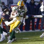 
              Chicago Bears' Dominique Robinson stops Green Bay Packers' Aaron Jones during the first half of an NFL football game Sunday, Dec. 4, 2022, in Chicago. (AP Photo/Charles Rex Arbogast)
            