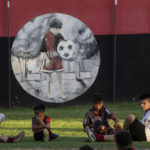 
              Children relax during a training in a football school at Newell's All Boys club, where Lionel Messi played as a kid in Rosario, Argentina, Wednesday, Dec.14, 2022. (AP Photo/Rodrigo Abd)
            