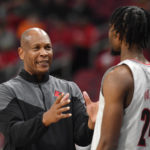 
              Louisville head coach Kenny Payne talks with forward Jae'Lyn Withers (24) during the first half of an NCAA college basketball game against Florida A&M in Louisville, Ky., Saturday, Dec. 17, 2022. (AP Photo/Timothy D. Easley)
            