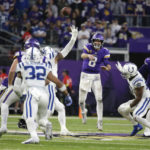 Minnesota Vikings quarterback Kirk Cousins (8) throws a pass during overtime in an NFL football game against the Indianapolis Colts, Saturday, Dec. 17, 2022, in Minneapolis. The Vikings won 39-36. (AP Photo/Andy Clayton-King)