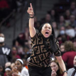 FILE - South Carolina head coach Dawn Staley directs her team during the first half of a first-round game against Howard in the NCAA women's college basketball tournament Friday, March 18, 2022 in Columbia, S.C. South Carolina won 79-21. (AP Photo/Sean Rayford, File)