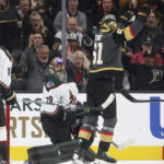 Vegas Golden Knights right wing Mark Stone (61) celebrates after scoring against Arizona Coyotes goaltender Karel Vejmelka (70) during the third period of an NHL hockey game Wednesday, Dec. 21, 2022, in Las Vegas. (AP Photo/Chase Stevens)