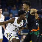 
              Notre Dame's Trey Wertz (3) works against Miami's Jordan Miller (11) during the first half of an NCAA college basketball game Friday, Dec. 30, 2022 in South Bend, Ind. (AP Photo/Michael Caterina)
            