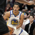 Golden State Warriors guard Jordan Poole looks on during the second half of an NBA basketball game in Toronto, Sunday, Dec. 18, 2022. (Frank Gunn/The Canadian Press via AP)
