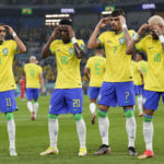 
              Brazil's Vinicius Junior, 2nd left, celebrates after scoring his side's opening goal during the World Cup round of 16 soccer match between Brazil and South Korea at the Stadium 974 in Doha, Qatar, Monday, Dec. 5, 2022. Left to right, Raphinha, Vinicius Junior, Lucas Paqueta, Neymar. (AP Photo/Jin-Man Lee)
            