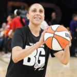 FILE - Phoenix Mercury's Diana Taurasi wears a T-shirt referring to teammate Brittney Griner before a WNBA basketball game against the Las Vegas Aces, Friday, May 6, 2022, in Phoenix. Brittney Griner said she's "grateful" to be back in the United States and plans on playing basketball again next season for the WNBA's Phoenix Mercury a week after she was released from a Russian prison and freed in a dramatic high-level prisoner exchange. "It feels so good to be home!" Griner posted to Instagram on Friday, Dec. 16, 2022, in her first public statement since her release. (AP Photo/Darryl Webb, File)