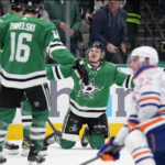 Dallas Stars' Roope Hintz, center, celebrates with Joe Pavelski (16) and others after scoring against the Edmonton Oilers in the first period of an NHL hockey game, Wednesday, Dec. 21, 2022, in Dallas. (AP Photo/Tony Gutierrez)