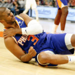 Phoenix Suns' Chris Paul (3) grabs his shoulder after a fall late in the second half of an NBA basketball game against the Washington Wizards in Phoenix, Tuesday, Dec. 20, 2022. Washington beat Phoenix 113-110. (AP Photo/Darryl Webb)