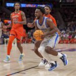 Memphis guard Alex Lomax, front right, makes a play against Auburn guard Allen Flanigan (22) during the second half of an NCAA college basketball game on Saturday, Dec. 10, 2022, in Atlanta. (AP Photo/Erik Rank)
