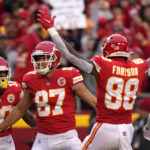 
              Kansas City Chiefs tight end Travis Kelce (87) celebrates with teammates after catching a 39-yard touchdown pass during the first half of an NFL football game against the Los Angeles Rams Sunday, Nov. 27, 2022, in Kansas City, Mo. (AP Photo/Charlie Riedel)
            