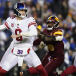New York Giants quarterback Daniel Jones (8) throws a pass during the first half of an NFL football game against the Washington Commanders, Sunday, Dec. 18, 2022, in Landover, Md. (AP Photo/Patrick Semansky)