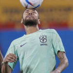 
              Brazil's Neymar practices during a training session at the Grand Hamad stadium in Doha, Qatar, Sunday, Dec. 4, 2022. Brazil will face South Korea in a World Cup round of 16 soccer match on Dec. 5. (AP Photo/Andre Penner)
            