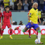 
              Brazil's Neymar scores from the penalty spot his side's second goal during the World Cup round of 16 soccer match between Brazil and South Korea, at the Education City Stadium in Al Rayyan, Qatar, Monday, Dec. 5, 2022. (AP Photo/Manu Fernandez)
            