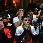 Morocco fans watch their team win the match against Spain at the World Cup soccer match tournament in Qatar, in Tudela, northern Spain, Tuesday, Dec. 6, 2022. (AP Photo/Alvaro Barrientos)