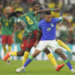 
              Brazil's Gabriel Jesus, right, and Cameroon's Andre-Frank Zambo Anguissa, left, fight for the ball during the World Cup group G soccer match between Cameroon and Brazil, at the Lusail Stadium in Lusail, Qatar, Friday, Dec. 2, 2022. (AP Photo/Moises Castillo)
            