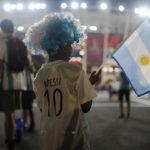 
              FILE - An Argentina soccer fan from India waits outside before the World Cup group C soccer match between Poland and Argentina at the Stadium 974 in Doha, Qatar, Wednesday, Nov. 30, 2022. (AP Photo/Natacha Pisarenko, File)
            