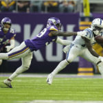 Indianapolis Colts wide receiver Ashton Dulin catches a pass ahead of Minnesota Vikings cornerback Chandon Sullivan (39) during the second half of an NFL football game, Saturday, Dec. 17, 2022, in Minneapolis. (AP Photo/Abbie Parr)