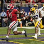 Georgia tight end Darnell Washington (0) scores a touch down in the first half of the Southeastern Conference championship NCAA college football game, Saturday, Dec. 3, 2022, in Atlanta. (AP Photo/Brynn Anderson)
