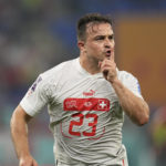 
              Switzerland's Xherdan Shaqiri celebrates after scoring his side's opening goal during the World Cup group G soccer match between Serbia and Switzerland, at the Stadium 974 in Doha, Qatar, Friday, Dec. 2, 2022. (AP Photo/Ebrahim Noroozi)
            