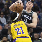 
              Sacramento Kings guard Kevin Huerter (9) is fouled by Los Angeles Lakers guard Patrick Beverley (21) during the first quarter of an NBA basketball game in Sacramento, Calif., Wednesday, Dec. 21, 2022. (AP Photo/José Luis Villegas)
            