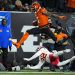 Cincinnati Bengals wide receiver Ja'Marr Chase (1) leaps over Kansas City Chiefs safety Juan Thornhill (22) in the first half of an NFL football game in Cincinnati, Sunday, Dec. 4, 2022. (AP Photo/Jeff Dean)
